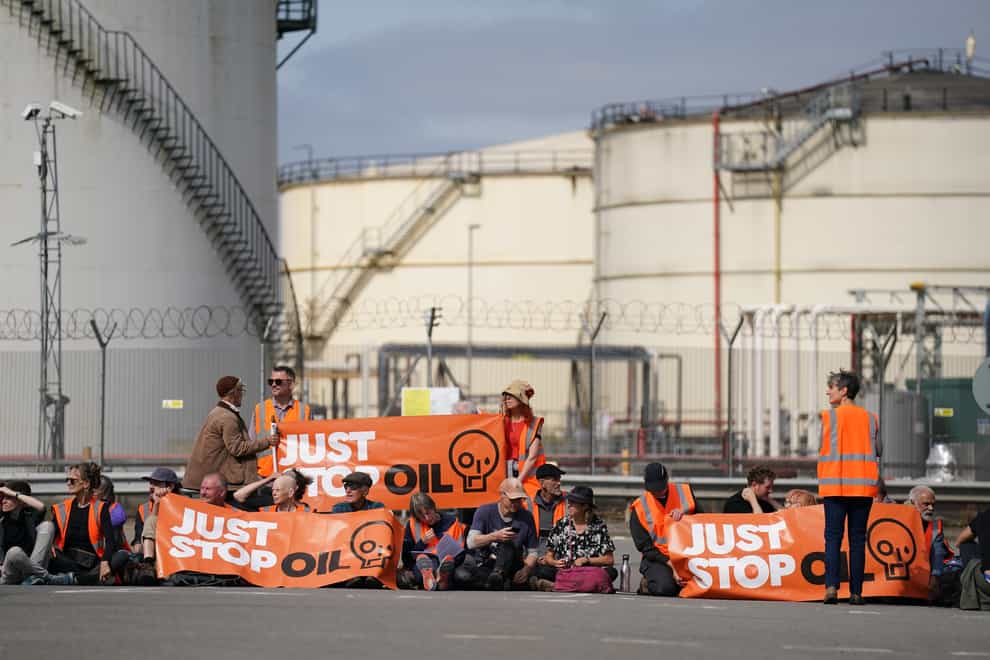 People take part in a Just Stop Oil protest blocking the entrance to the Kingsbury Oil Terminal near Birmingham on September 14 (Joe Giddens/PA)