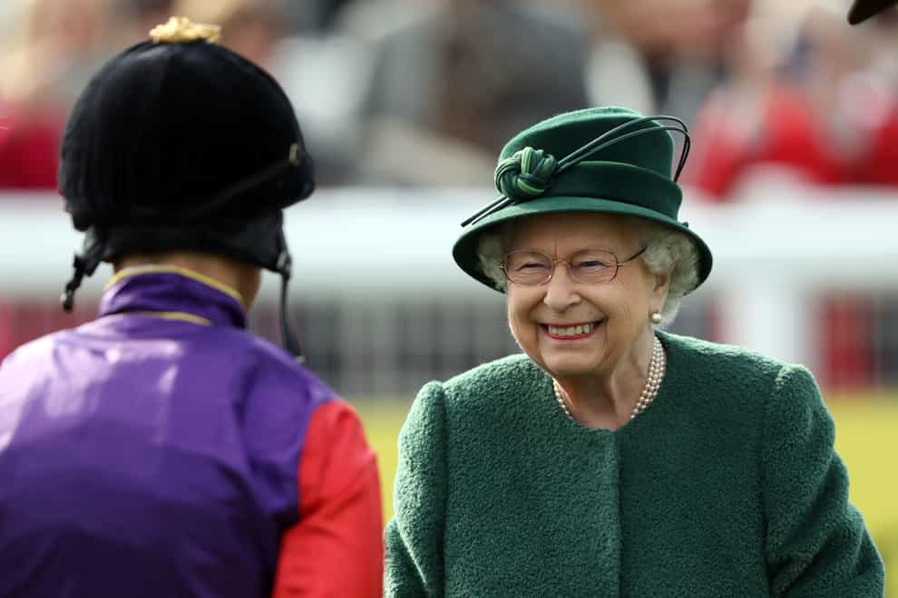 Queen Elizabeth II talks to jockey Frankie Dettori at Newbury’s spring meeting (Steve Parsons/PA)