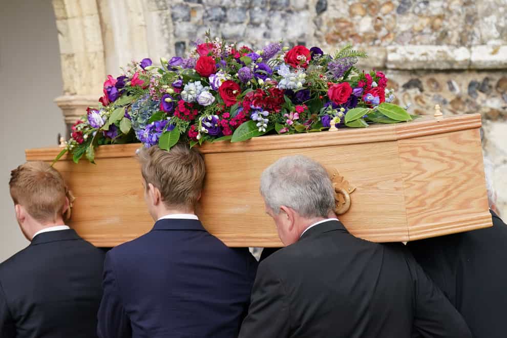 Pallbearers carry the coffin of TV presenter and journalist Bill Turnbull into Holy Trinity Church in Blythburgh, Suffolk (Joe Giddens/PA)