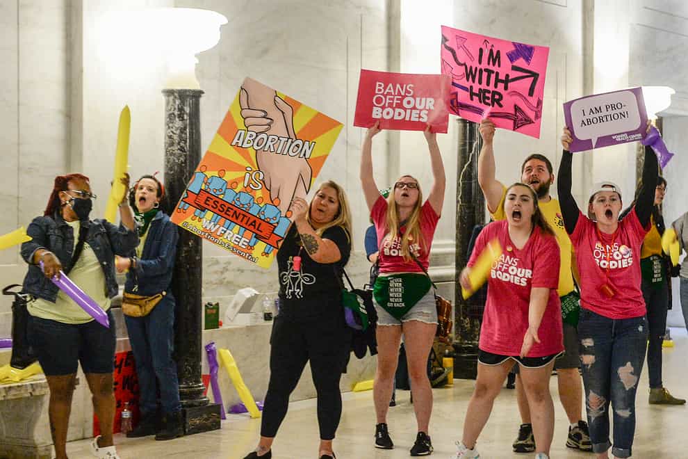 Abortion rights supporters demonstrate outside the Senate chamber at the West Virginia state Capitol (Chris Dorst/Charleston Gazette-Mail via AP)