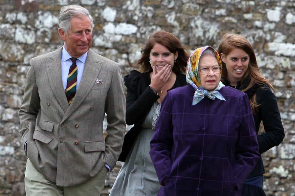 The Queen with the Prince of Wales (left), Princess Eugenie, (back left), and Princess Beatrice (back right) and the rest of the Royal family at the Castle of Mey after disembarking the Hebridean Princess boat after a private family holiday with Queen Elizabeth II around the Western Isles of Scotland.