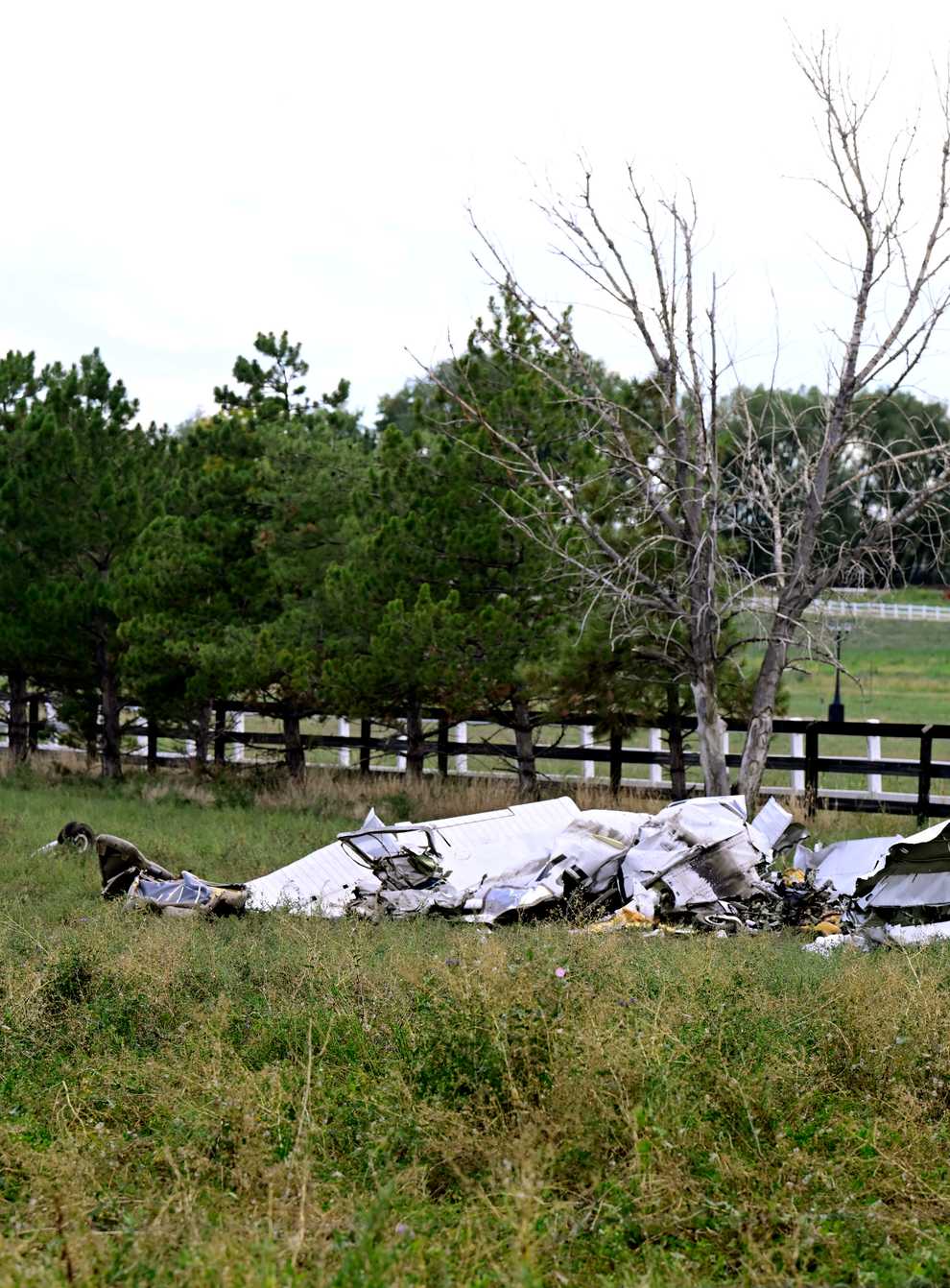 A crashed plane, one of two, lies along Niwot Road between Highway 287 and N 95th Street in Longmont, Colorado (Andy Cross/The Denver Post via AP)