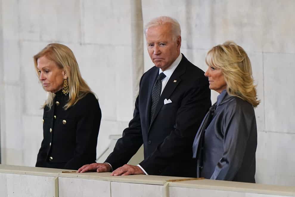 President Joe Biden and first lady Jill Biden view the coffin of Queen Elizabeth II, lying in state on the catafalque in Westminster Hall (Joe Giddens/PA)