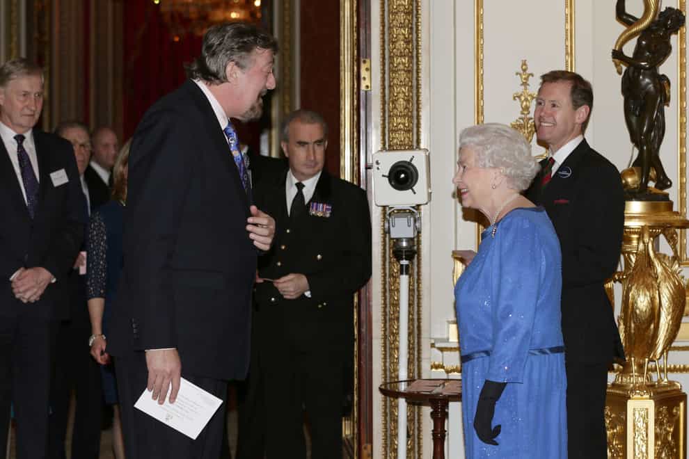 Stephen Fry meets the Queen at Buckingham Palace (PA)