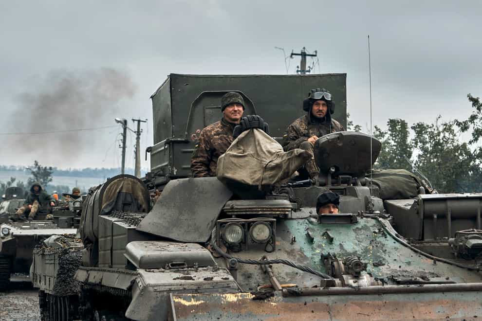 Ukrainian military vehicles in the Kharkiv region (Kostiantyn Liberov/AP)