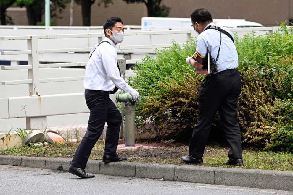 A man set himself on fire near the Japanese prime minister’s office in Tokyo in apparent protest against the funeral for former leader Shinzo Abe (Kyodo News/AP)