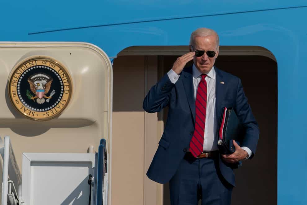 President Joe Biden returns a salute before boarding Air Force One at Andrews Air Force Base (AP)