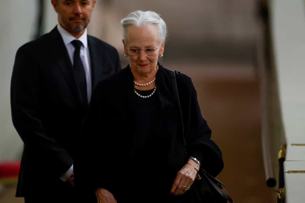 Denmark’s Queen Margrethe pays her respects to Queen Elizabeth II during her lying in state at Westminster Hall in London (John Sibley/Pool via AP)