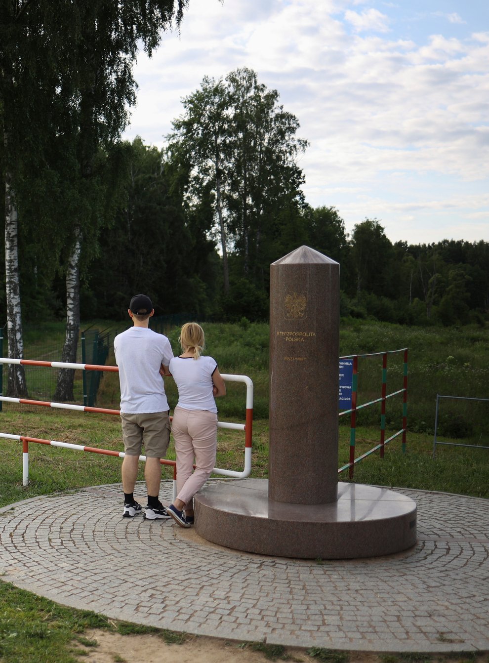 People visit the area of tripoint marking the place where borders of Poland, Lithuania and Russia’s Kaliningrad Oblast meet, in Zerdziny, Poland (Michal Dyjuk/AP)