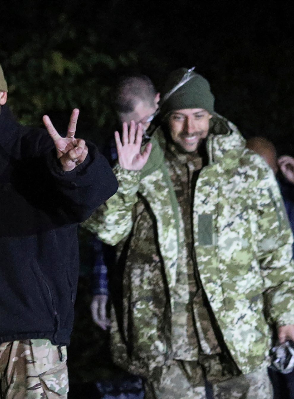 Ukrainian soldiers, who were released in a prisoner exchange between Russia and Ukraine, smile close to Chernihiv, Ukraine (Ukrainian Security Service Press Office/AP)