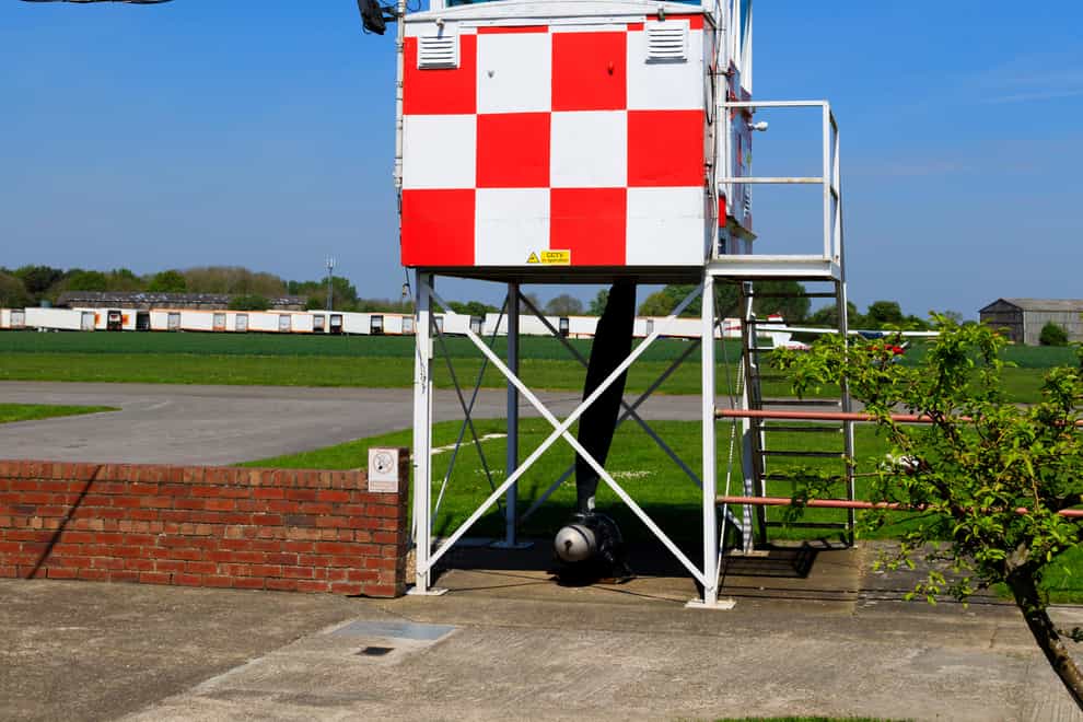 T8YMAK Control tower and windsock at the former RAF Breighton airfield in the East Riding of Yorkshire. Home to the Lincoln Aero Club and the Real Aeroplane