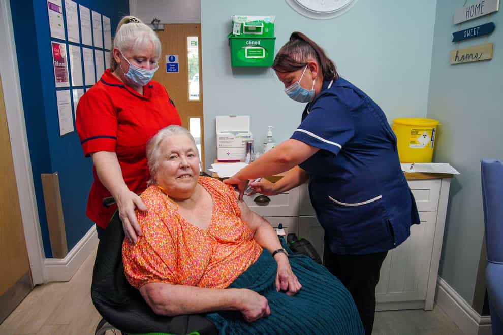 Care home resident Sylvia Everritt receives her autumn Covid-19 booster vaccination at Gorsey Clough Nursing Home, Tottington, Bury (Peter Byrne/PA)