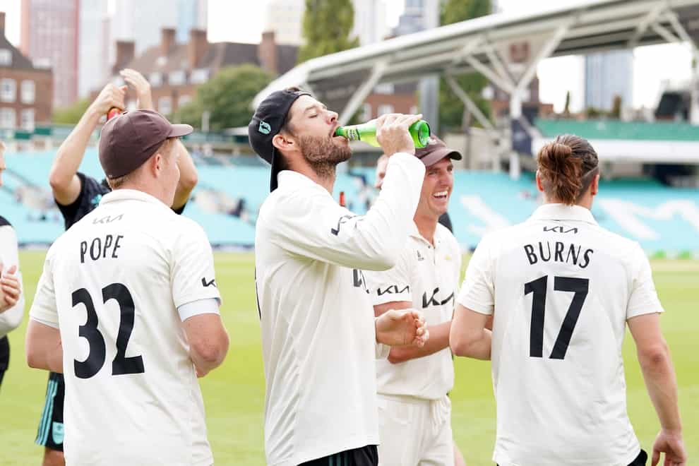 Ben Foakes celebrates as Surrey sealed the Division One title (Adam Davy/PA)
