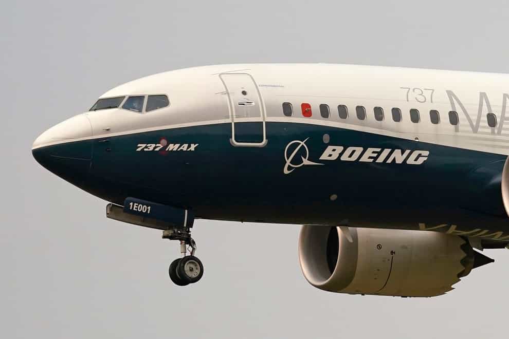 A Boeing 737 Max jet prepares to land (Elaine Thompson/AP)