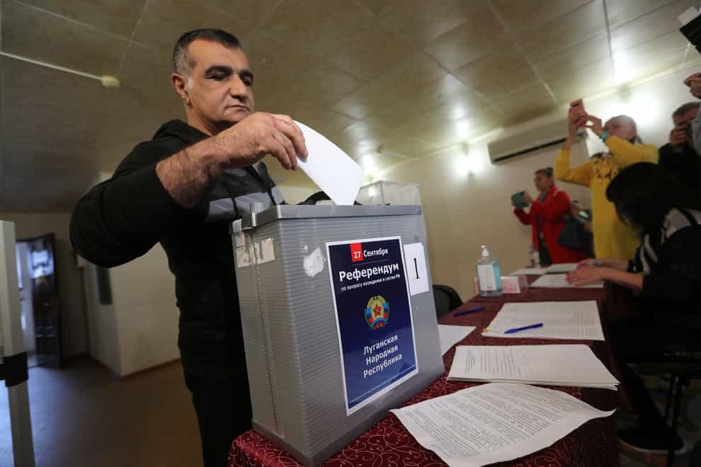 A man from Luhansk region votes in the so-called referendum (AP)