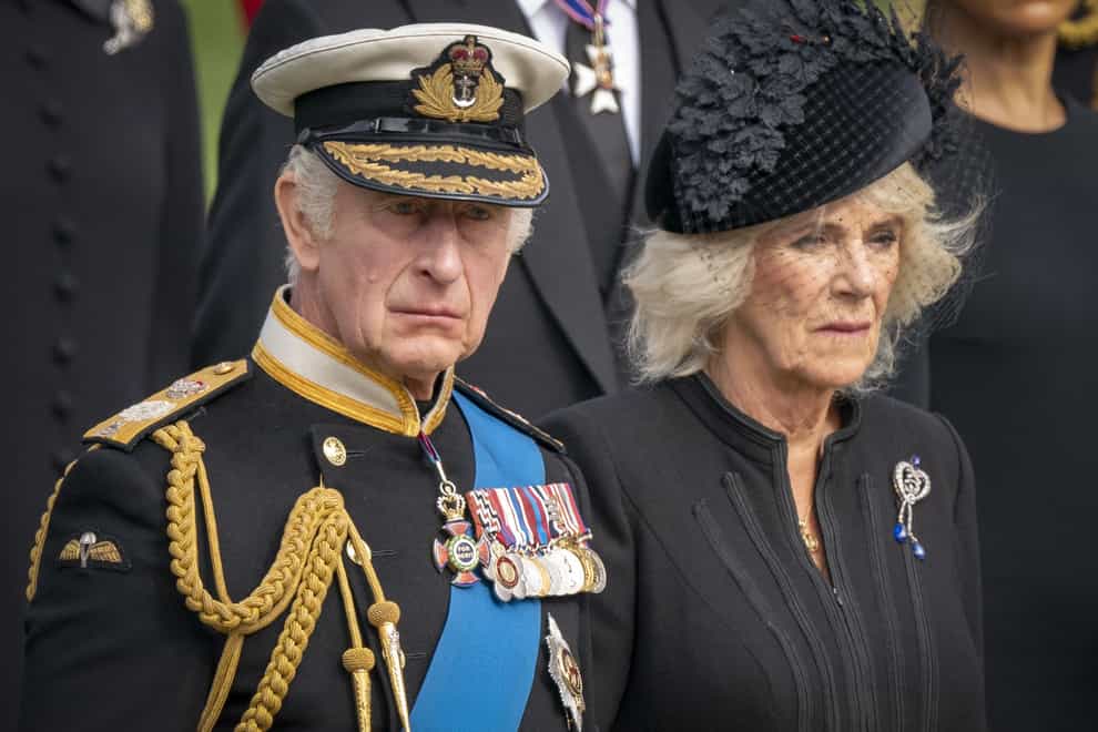 King Charles III and the Queen Consort look on at the funeral for the Queen (Jane Barlow/PA)