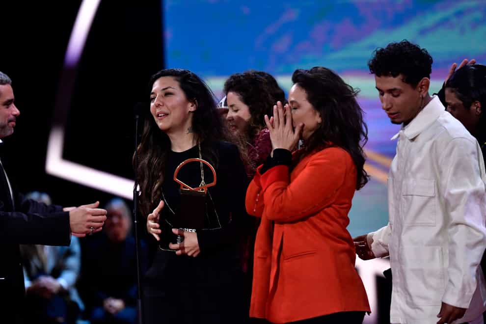 Colombian film director Laura Mora receives the Golden Shell award (Alvaro Barrientos/AP)