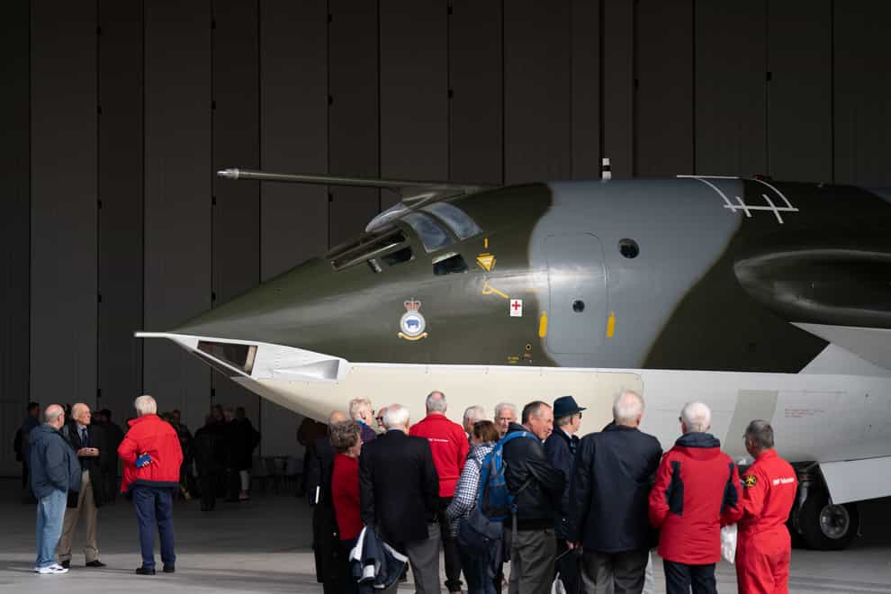 Cold War veterans view the Handley Page Victor XH648 aircraft after the completion of its five-year restoration project (Joe Giddens/ PA)