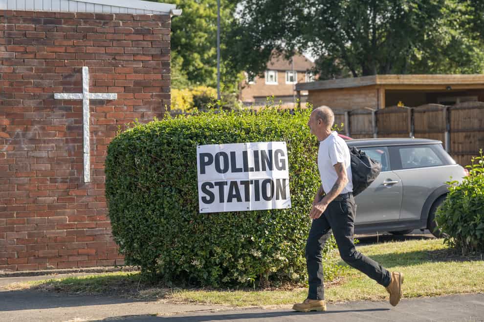 A man walks past a polling station (Danny Lawson/PA)