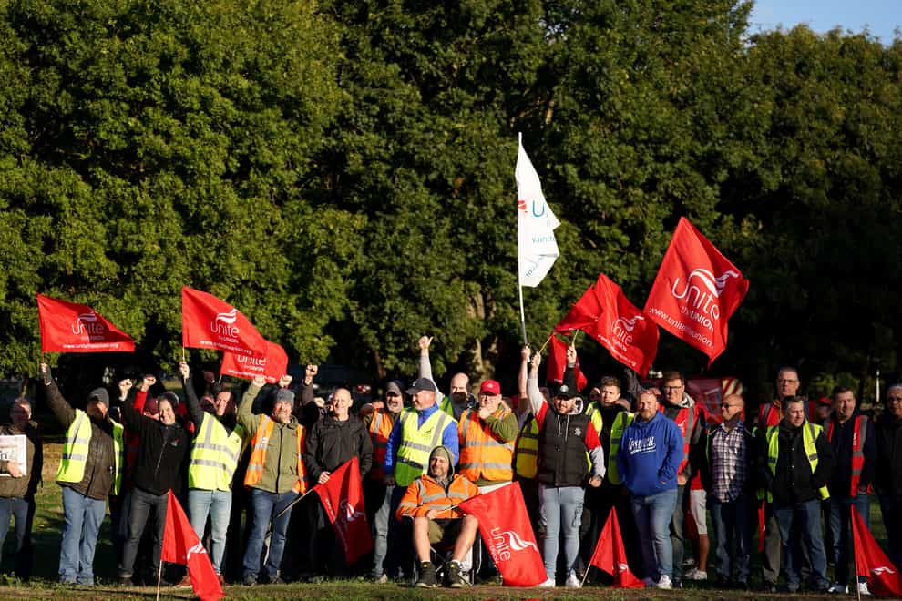 Members of the Unite union man a picket line at one of the entrances to the Port of Felixstowe in Suffolk in a long-running dispute over pay. (Joe Giddens/PA)