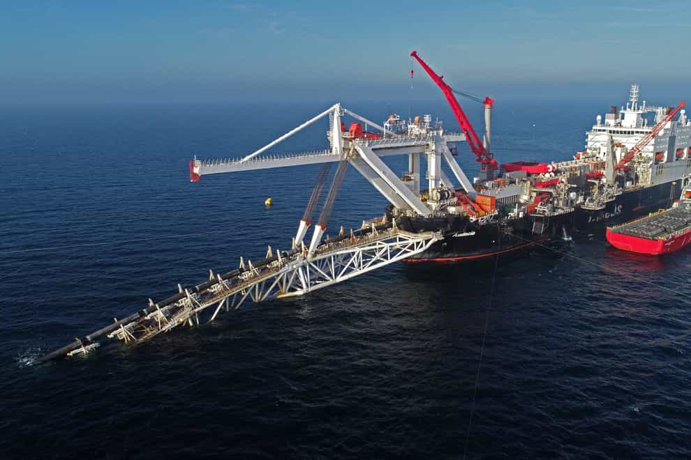 FILE – A ship works offshore in the Baltic Sea on the natural gas pipeline Nord Stream 2 from Russia to Germany, on Nov. 11, 2018. Denmark’s maritime authority said Monday Sept. 26, 2022 that a gas leak had been observed in a pipeline leading from Russia to Europe underneath the Baltic Sea that is dangerous to shipping traffic. (Bernd Wuestneck/dpa via AP, File)