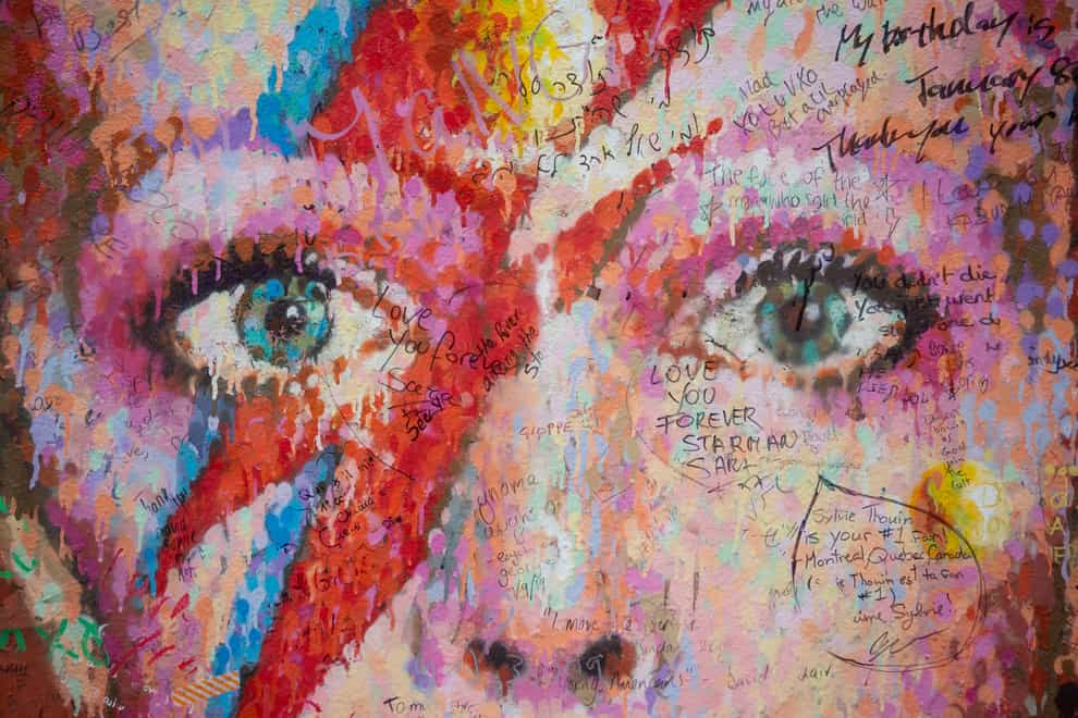 Messages written on the David Bowie mural in Brixton, south London. Bowie’s lyrics to Starman have gone under the hammer (Dominic Lipinski/PA)