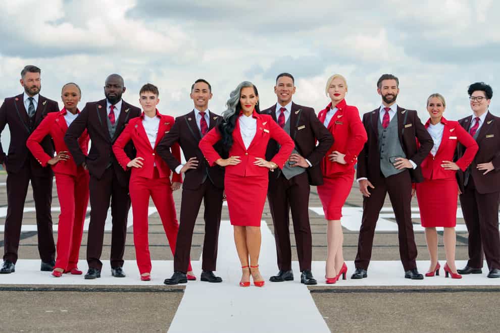 Michelle Visage (centre) with others modelling the Virgin Atlantic uniform options for the launch of the airline’s updated gender identity policy (Ben Queenborough/Virgin Atlantic/PA)