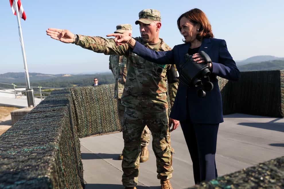 US vice president Kamala Harris uses binoculars at the military observation post as she visits the demilitarised zone separating the two Koreas, in Panmunjom, South Korea (Leah Millis/Pool Photo via AP)