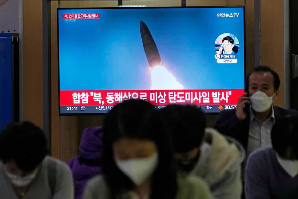 A TV screen shows a file image of North Korea’s missile launch during a news programme at the Seoul Railway Station (Ahn Young-joon/AP)