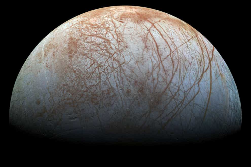 Europa is thought to have an ocean flowing beneath its thick frozen crust (NASA/JPL-Caltech/SETI Institute via AP)