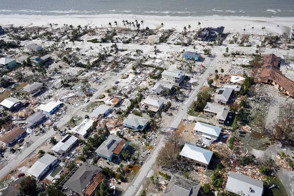 Damaged homes and debris in the aftermath of Hurricane Ian (Wilfredo Lee/AP)