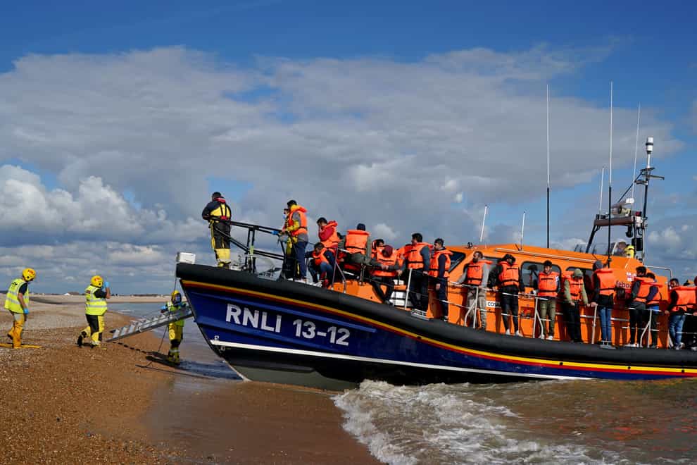 A group of people thought to be migrants is brought in to Dungeness, Kent, by the RNLI following a small boat incident in the Channel. Picture date: Wednesday September 21, 2022 (Gareth Fuller/PA)