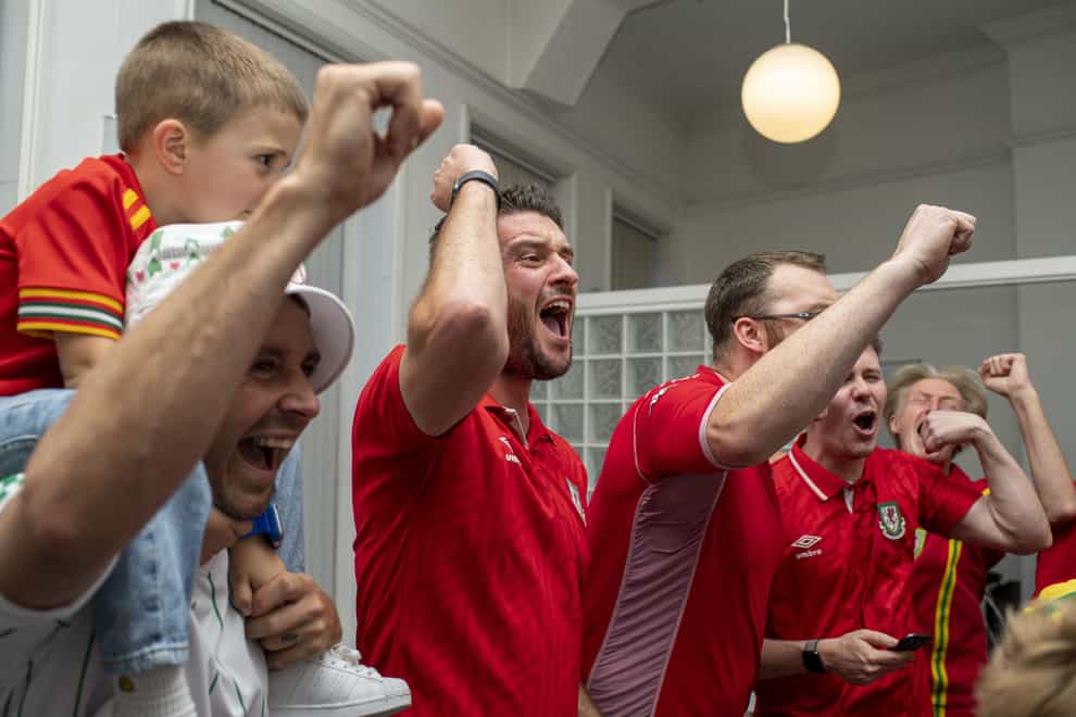Andrew Dowling (centre) and Wales football fans take part in the recording of a charity World Cup song (Andrew Dowling/PA)