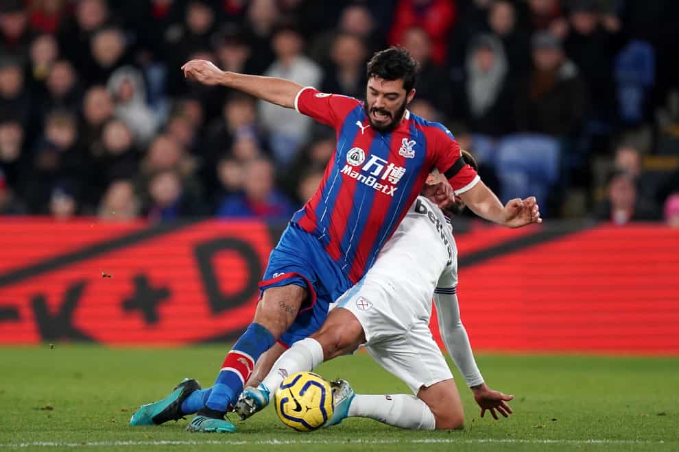 Crystal Palace’s James Tomkins (left) will return to Patrick Vieira’s squad to face Chelsea (John Walton/PA)