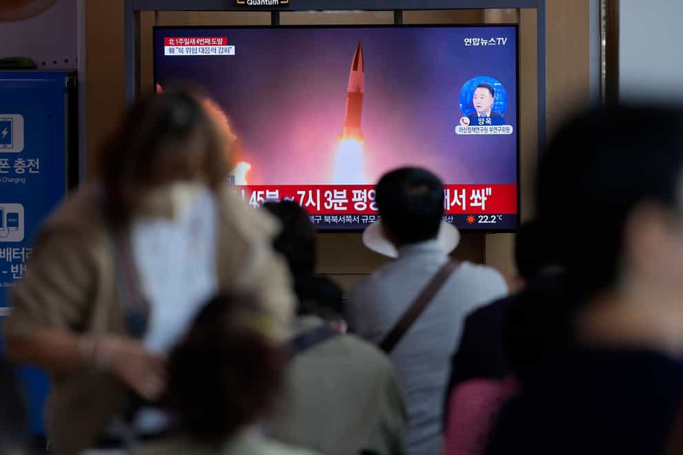 A TV screen in a rail station in Seoul, South Korea, shows a news programme reporting the missile launch (Lee Jin-man/AP/PA)