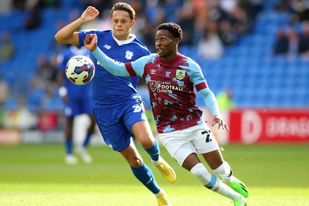 Burnley’s Nathan Tella, right, and Cardiff’s Perry Ng battle for possession (Nigel French/PA)