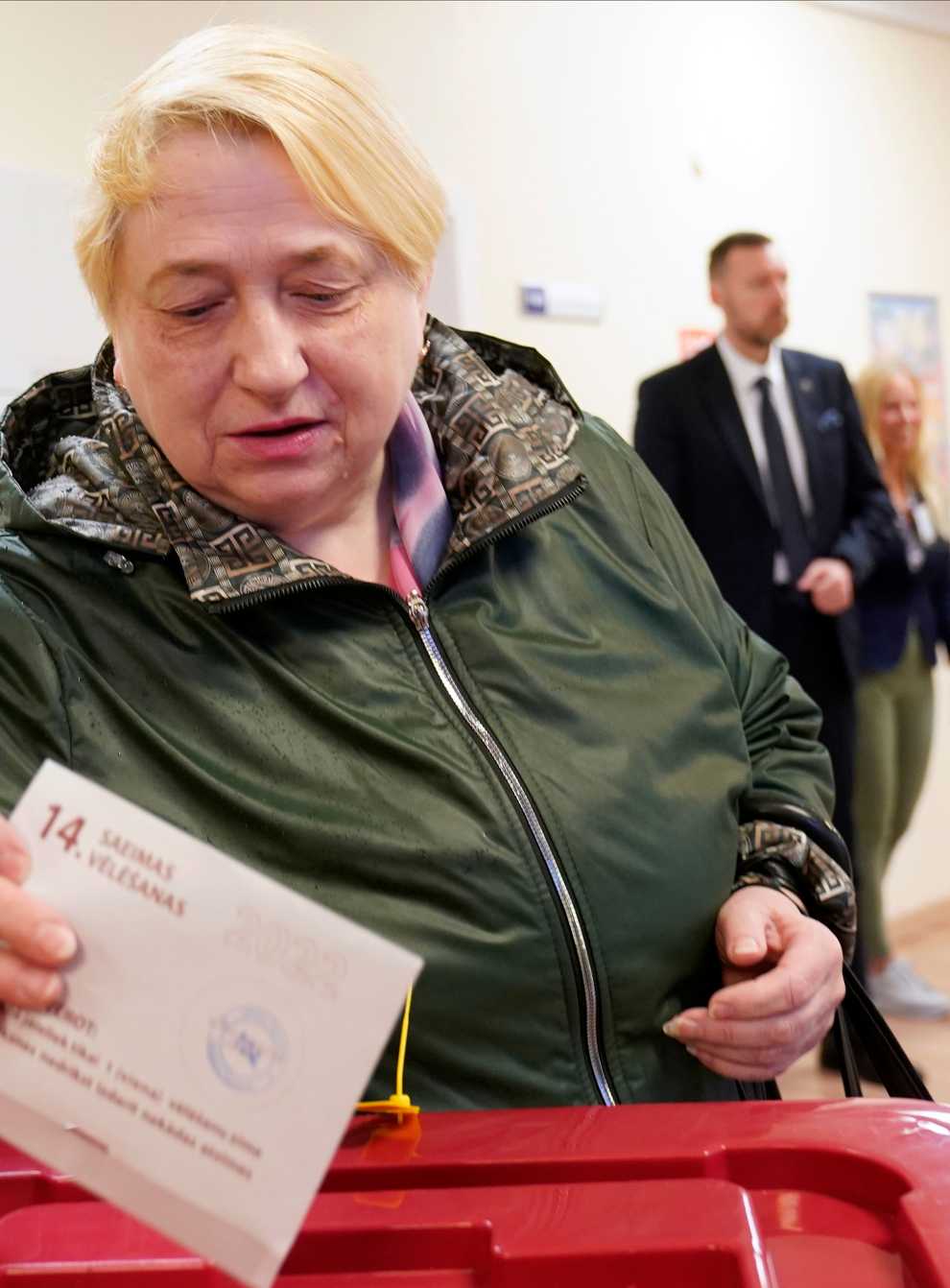 A woman casts her ballot at a polling station during general elections in Riga (AP)