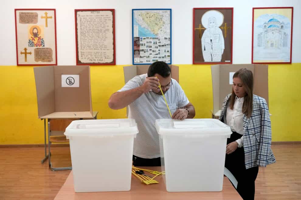 Polls opened in Bosnia on Sunday in a general election that is unlikely to bring any structural change (Darko Vojinovic/AP)