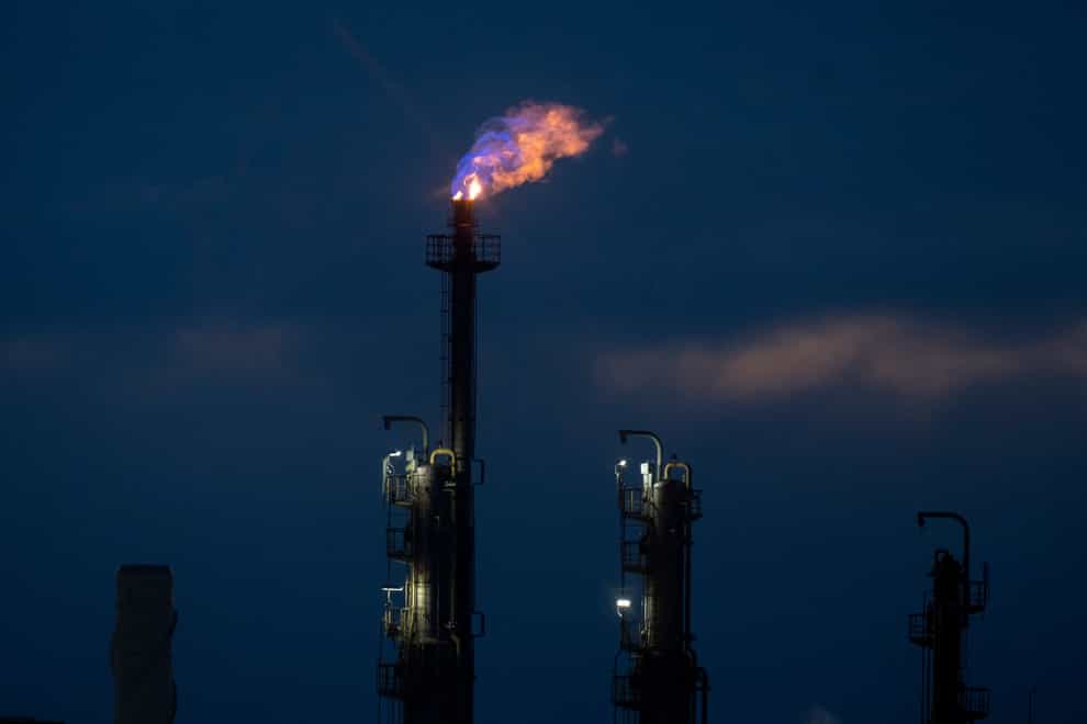 A flame is seen on top of a chimney at the BASF chemical plant in Ludwigshafen, Germany (AP)