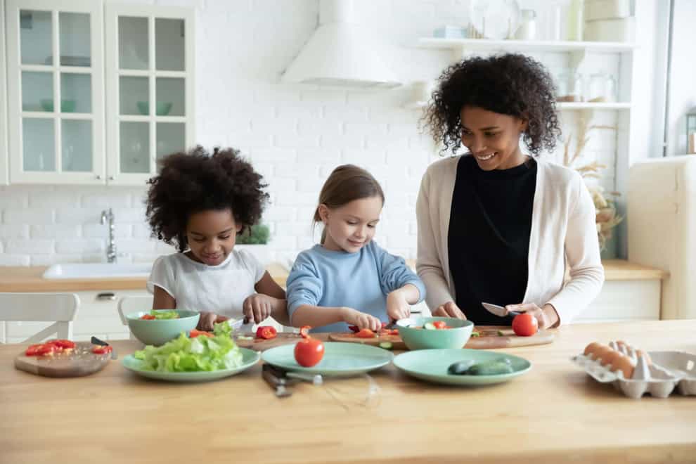 Learning to cook can help children feel more connected to food (Alamy/PA)