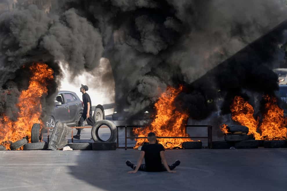 Tyres burned by Palestinians at the site where two Palestinians were shot and killed by the Israeli army (AP)