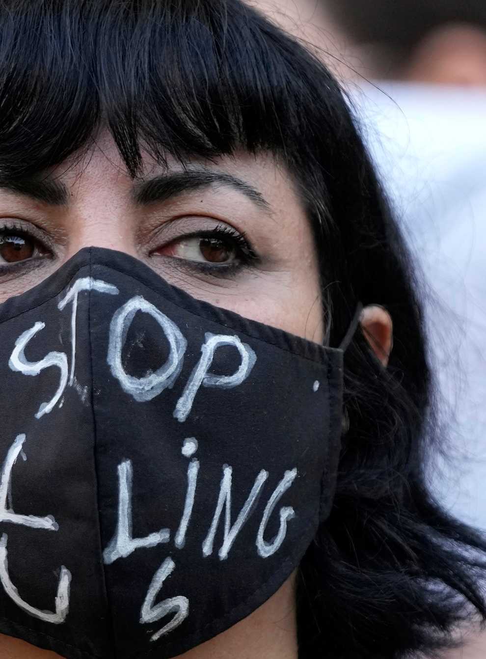 An activist wears a message on her protective face mask “Stop Killing Us” during a protest against the death of Iranian Mahsa Amini in Iran, in Beirut, Lebanon (AP)