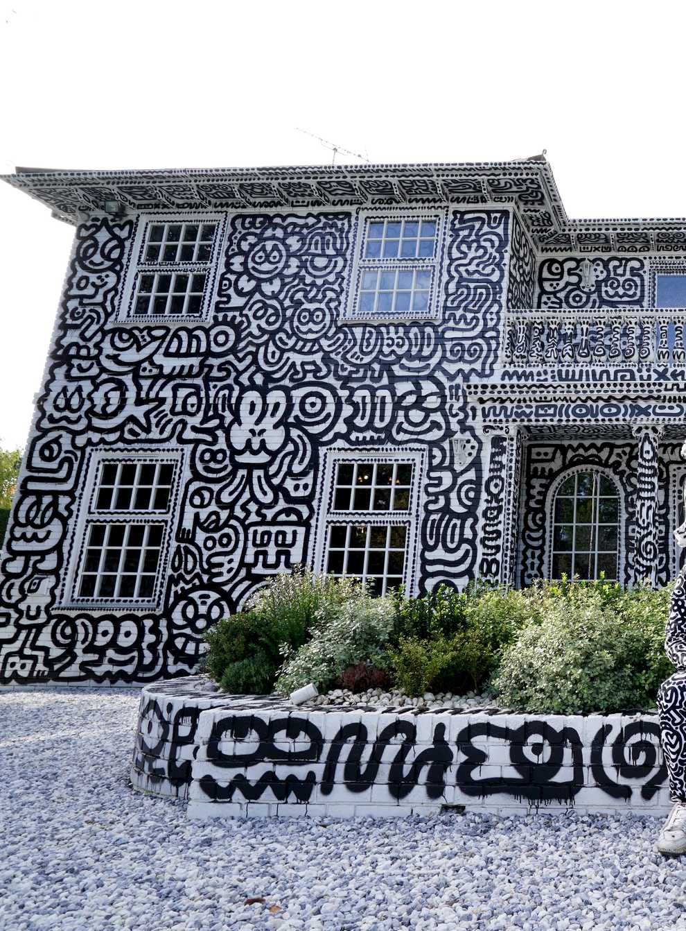 British artist Sam Cox, aka Mr Doodle, reveals the Doodle House, a 12-room mansion at Tenterden in Kent which has been covered inside and out in the artist’s trademark monochrome, cartoonish hand-drawn doodles (Gareth Fuller/PA)