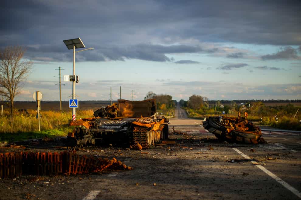 Remains of a destroyed Russian tank are scattered on the ground along the road between Izium and Kharkiv, Ukraine (Francisco Seco/AP)