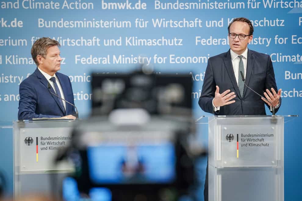 German climate protection minister Robert Habeck and RWE chief executive Markus Krebber give a press conference on the agreement (Kay Nietfeld/dpa/AP)