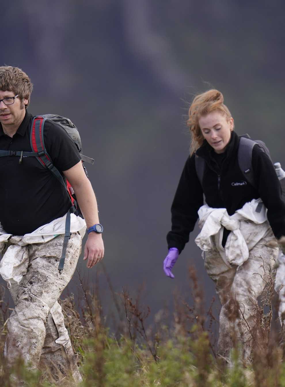 Officers from Greater Manchester Police during a search on Saddleworth Moor (PA)