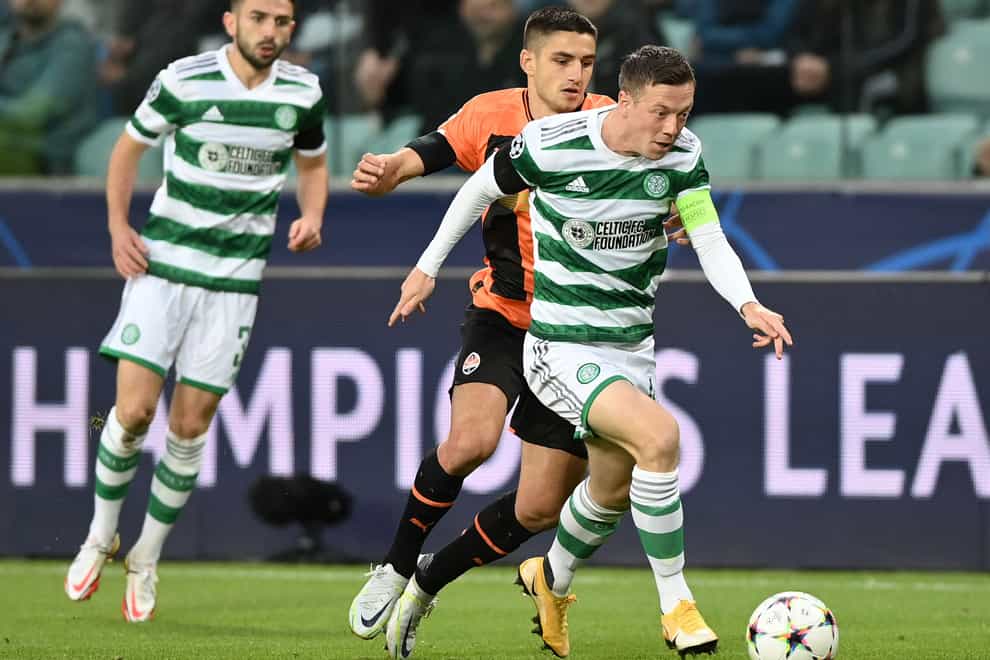 Callum McGregor, right, runs with the ball against Shakhtar Donetsk (Rafal Oleksiewicz/PA)
