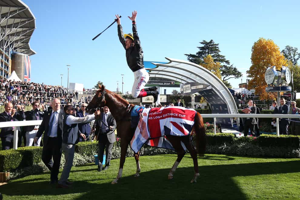 Stradivarius and Frankie Dettori after winning The QIPCO British Champions Long Distance Cup Race run during the QIPCO British Champions Day at Ascot Racecourse.