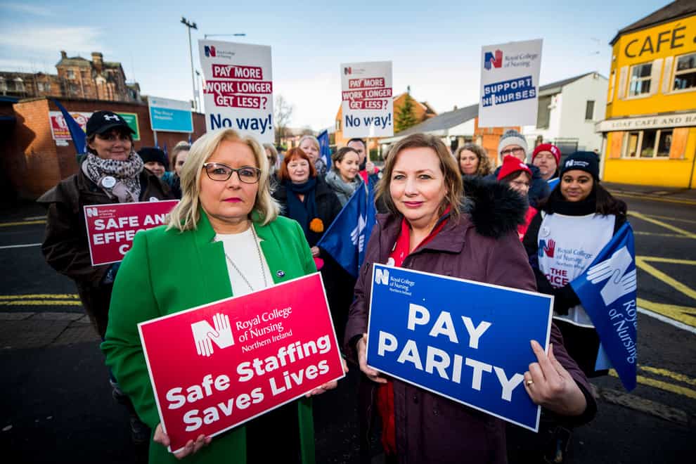 Royal College of Nursing general secretary Pat Cullen (left) with Royal Belfast Hospital for Sick Children ward sister Ann McDonald on the picket line with nurses and supporters during previous Northern Ireland strike action (Liam McBurney/PA)