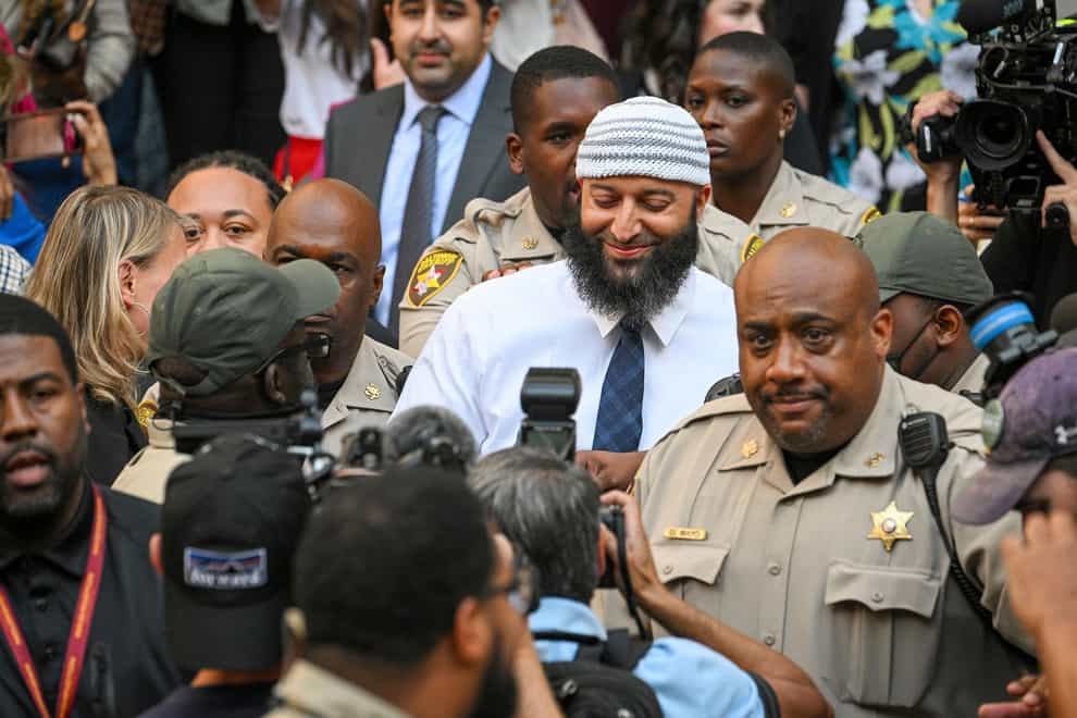 Adnan Syed, centre, whose legal saga spawned the hit podcast Serial, exits the Cummings Courthouse after a Baltimore judge overturned his conviction for the 1999 murder of high school student Hae Min Lee on Sept, 19, 2022, in Baltimore (Jerry Jackson/The Baltimore Sun via APPA)